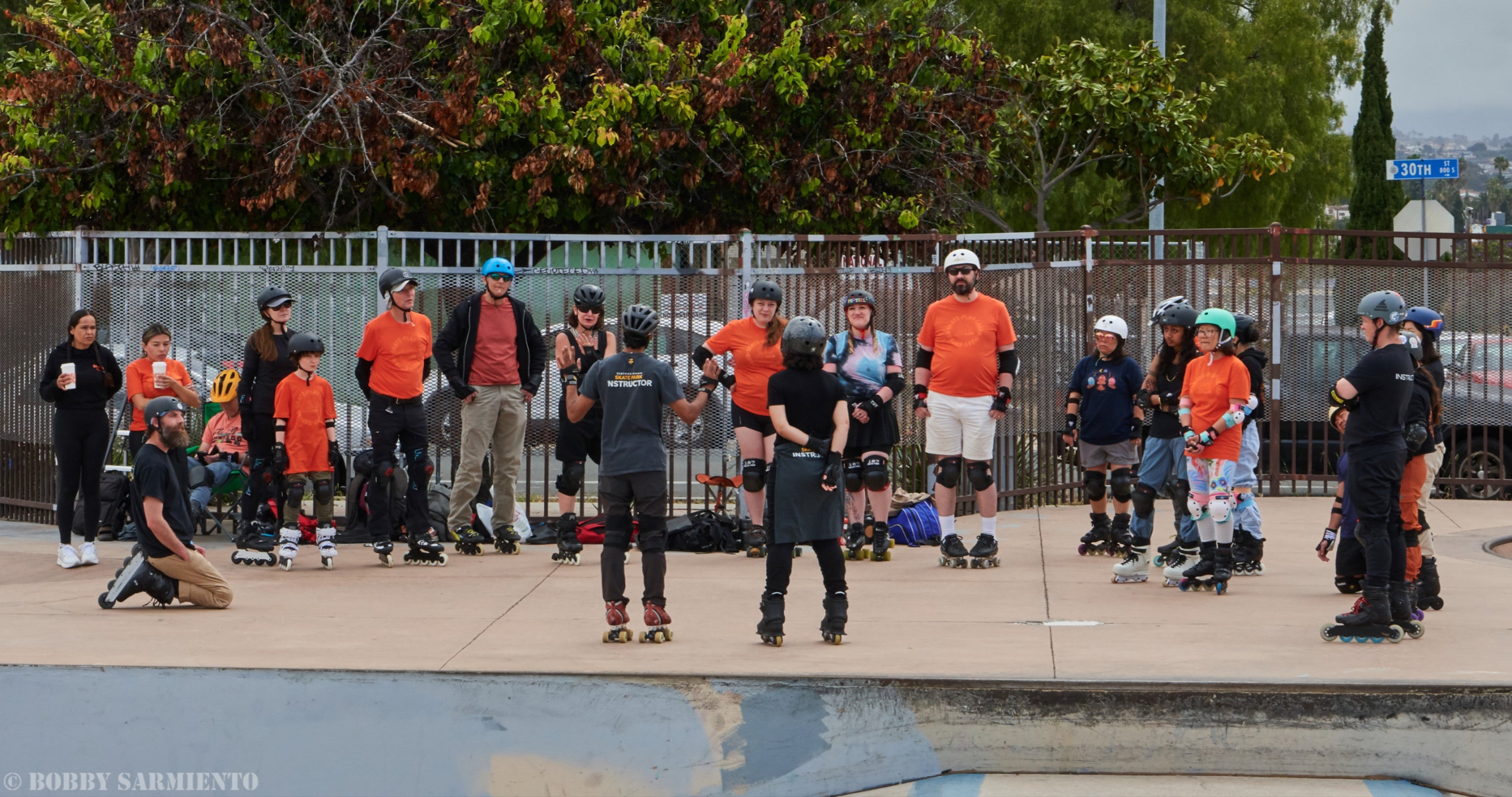 skate park lesson in progress for inline and quad skaters